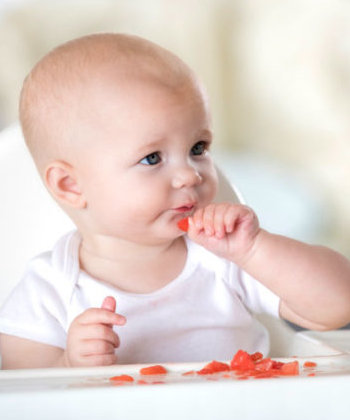 baby eating fruit